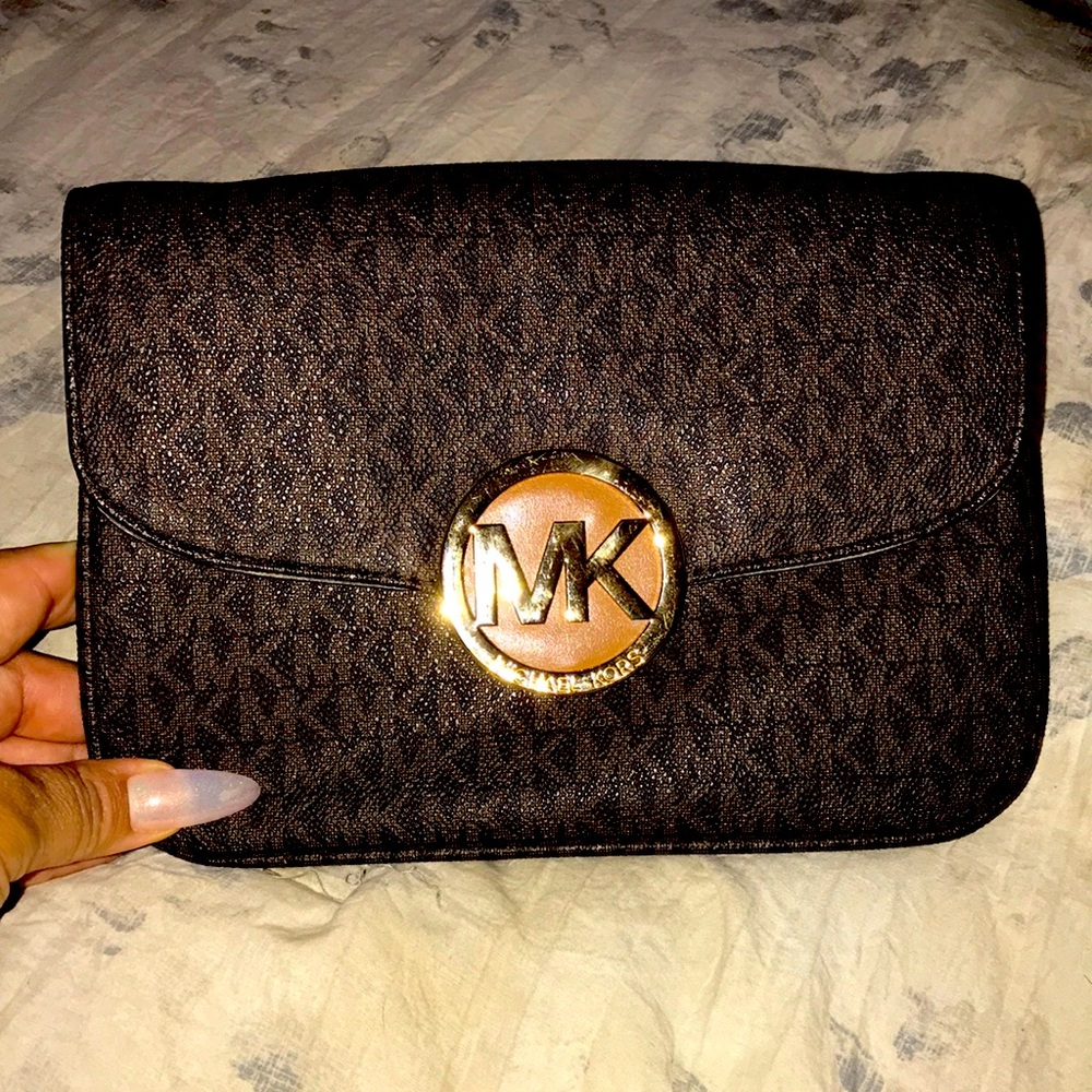 MK clutch bag missing the strap.